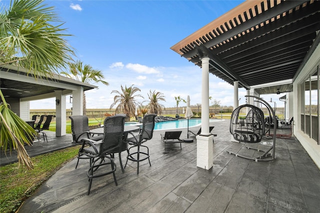 view of patio featuring a fenced in pool, a fenced backyard, and a pergola