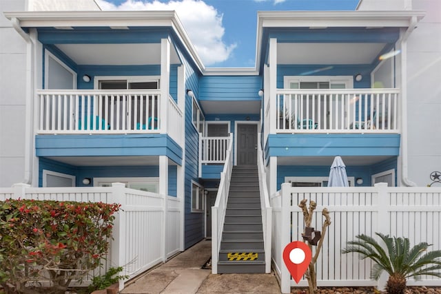 exterior space featuring stairs and fence