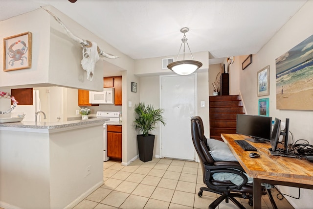 home office featuring light tile patterned floors and visible vents