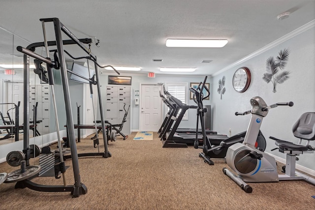 gym with carpet flooring, a textured ceiling, baseboards, and ornamental molding