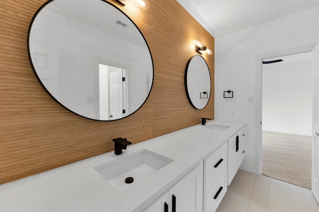 full bathroom with tile patterned floors, visible vents, double vanity, and a sink