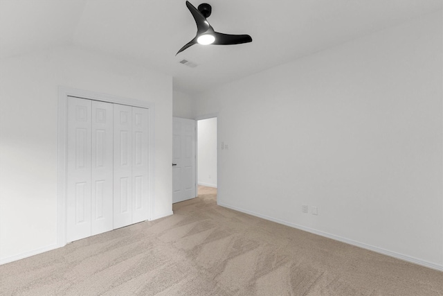 unfurnished bedroom with a ceiling fan, baseboards, visible vents, a closet, and carpet flooring