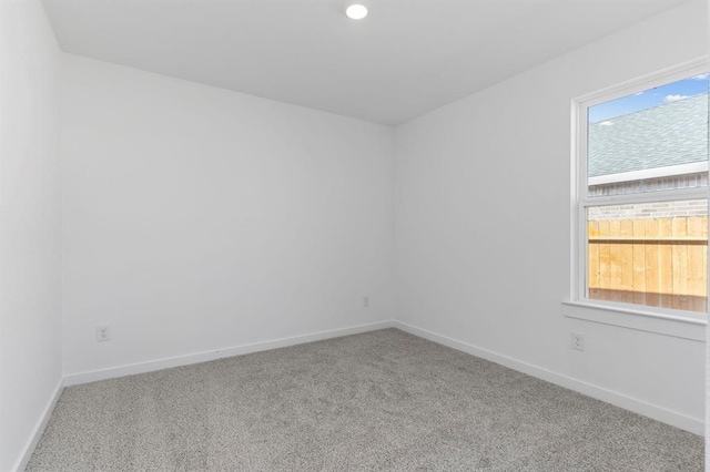 carpeted spare room with recessed lighting and baseboards