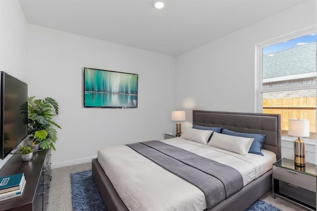 bedroom with baseboards and carpet floors