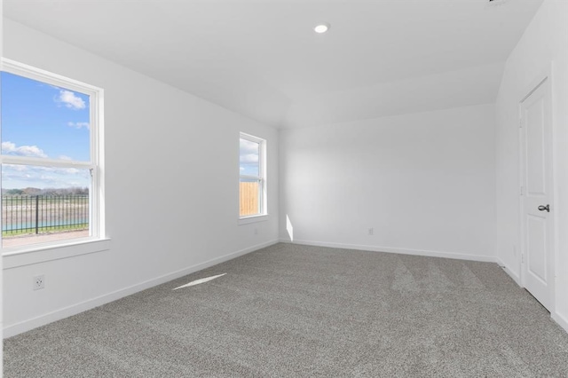 unfurnished room featuring recessed lighting, baseboards, and carpet floors