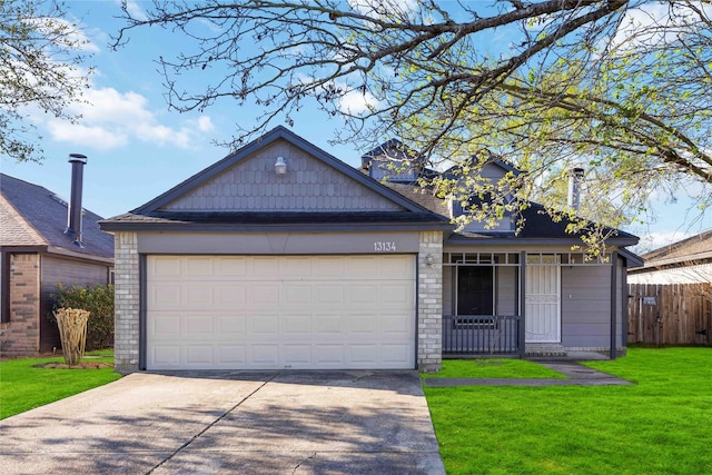 view of front facade featuring driveway, an attached garage, a front yard, and fence