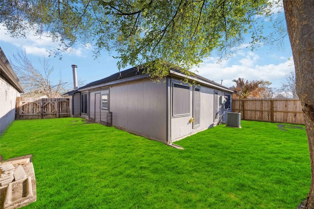 exterior space featuring a fenced backyard and central AC