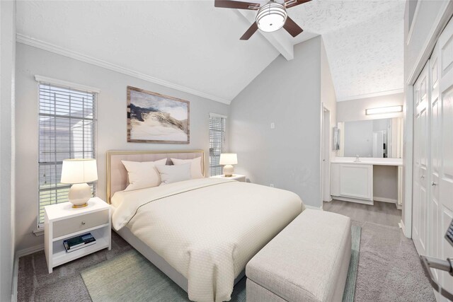 bedroom with lofted ceiling with beams, baseboards, a textured ceiling, and a ceiling fan