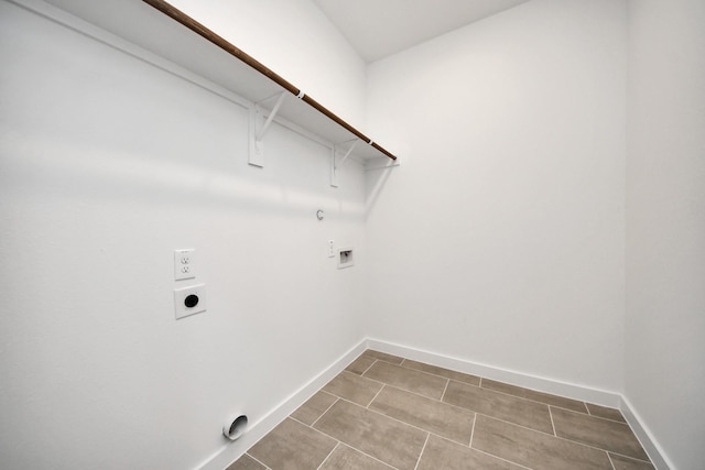 laundry area featuring electric dryer hookup, baseboards, gas dryer hookup, hookup for a washing machine, and laundry area