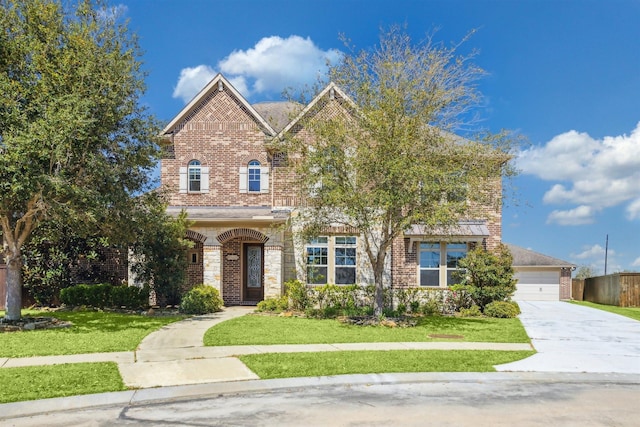 view of front of property featuring brick siding, a garage, concrete driveway, and a front lawn