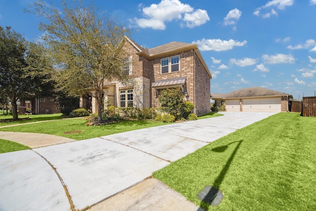 traditional home featuring a detached garage, brick siding, and a front lawn