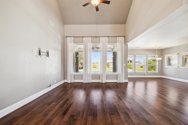 interior space featuring visible vents, baseboards, dark wood-style floors, and ceiling fan with notable chandelier