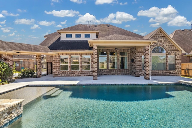 view of pool with a fenced in pool, fence, ceiling fan, and a patio area