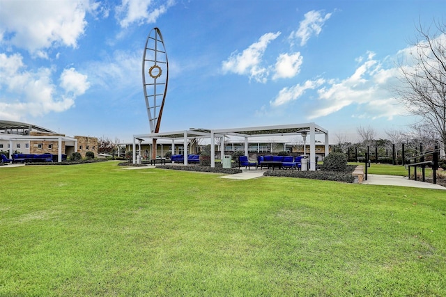 view of community featuring a lawn and a pergola