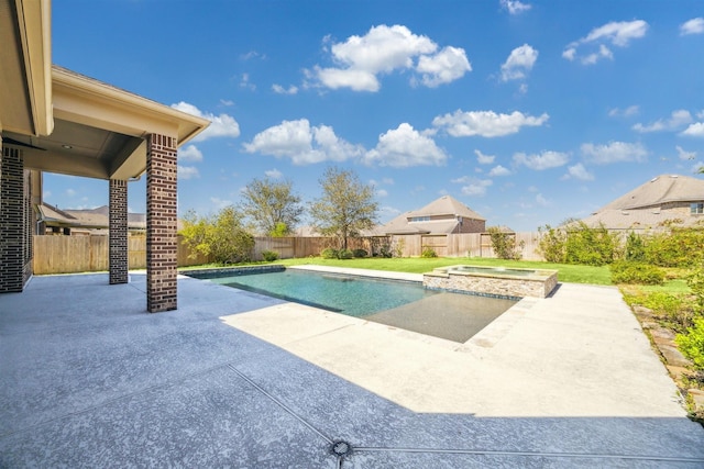 view of pool featuring a fenced backyard, a pool with connected hot tub, and a patio