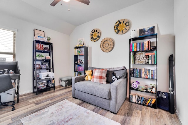 office featuring baseboards, wood finished floors, a ceiling fan, and vaulted ceiling