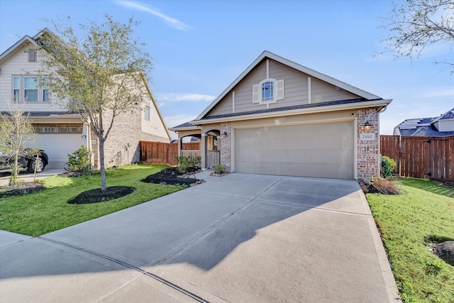 view of front of home with brick siding, driveway, a front yard, and fence