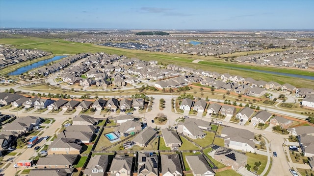 birds eye view of property featuring a residential view and a water view