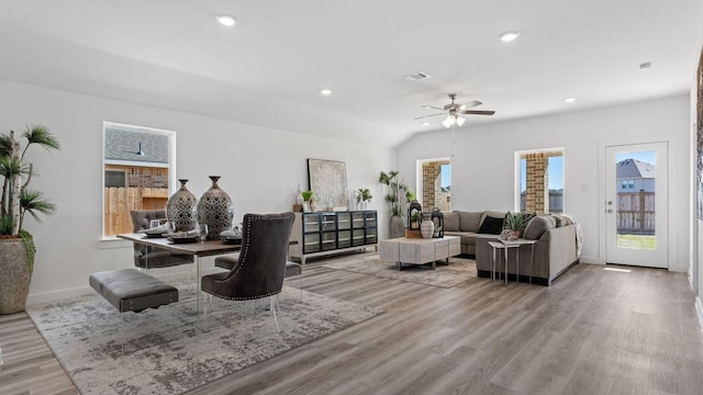 living area featuring light wood finished floors, visible vents, recessed lighting, and baseboards