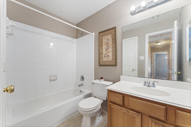 full bath with vanity, tile patterned floors, toilet, and shower / tub combination