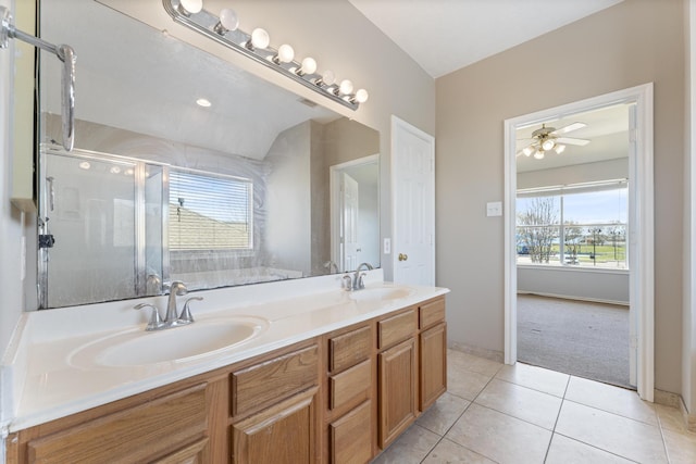 bathroom with a wealth of natural light, a shower stall, and a sink