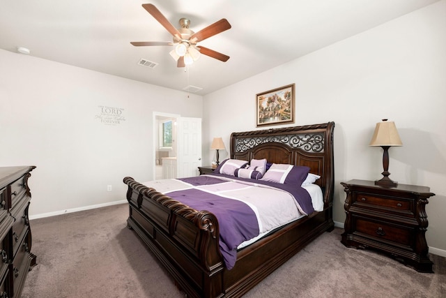 bedroom with a ceiling fan, baseboards, visible vents, carpet floors, and ensuite bathroom