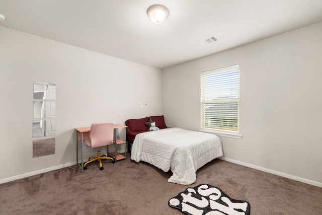 carpeted bedroom with baseboards and visible vents