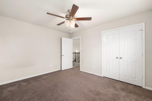 unfurnished bedroom with a closet, ceiling fan, baseboards, and carpet floors