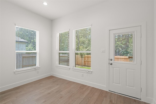 interior space with recessed lighting, light wood-style floors, and baseboards