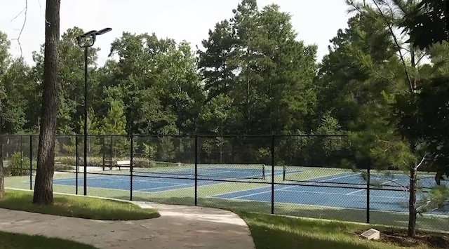 view of sport court with fence