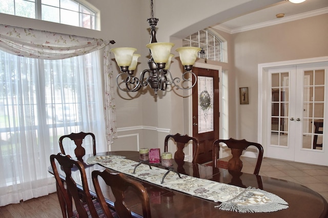 16815 Coronado Springs Dr, Spring, TX 77379 - tiled dining space featuring french doors, ornamental molding, and a wealth of natural light