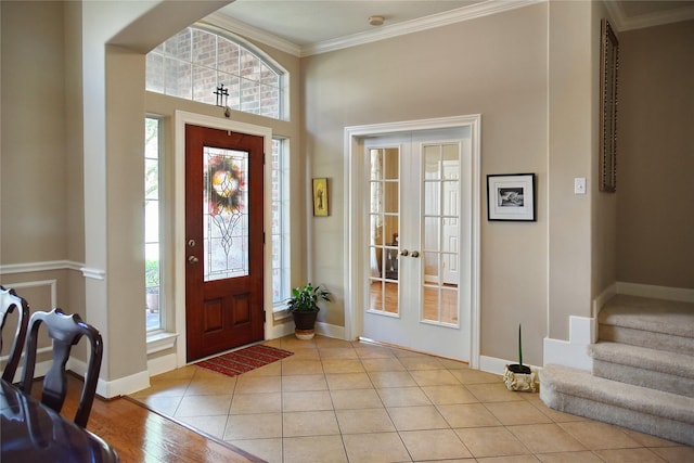 16815 Coronado Springs Dr, Spring, TX 77379 - foyer entrance featuring a wealth of natural light, french doors, ornamental molding, and light tile patterned floors