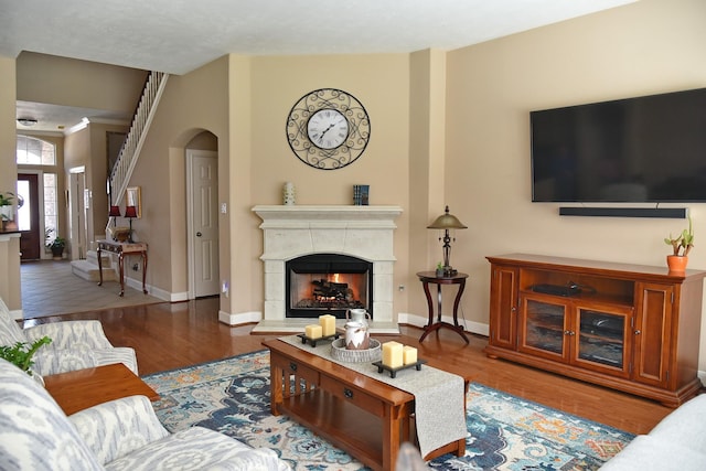 16815 Coronado Springs Dr, Spring, TX 77379 - living area featuring baseboards, wood finished floors, and a tile fireplace