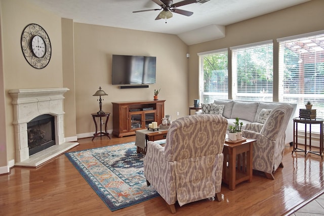 16815 Coronado Springs Dr, Spring, TX 77379 - living area with a ceiling fan, a fireplace with raised hearth, baseboards, and wood finished floors