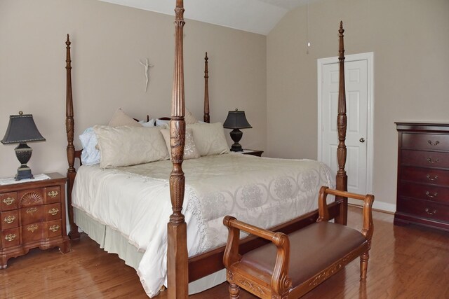 16815 Coronado Springs Dr, Spring, TX 77379 - bedroom featuring vaulted ceiling and wood finished floors