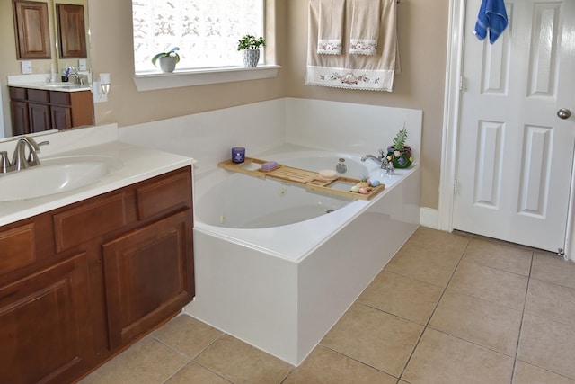 16815 Coronado Springs Dr, Spring, TX 77379 - bathroom featuring tile patterned floors, a whirlpool tub, and a sink