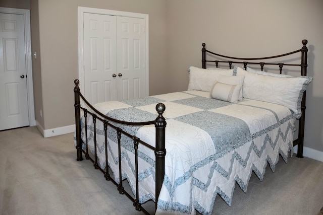16815 Coronado Springs Dr, Spring, TX 77379 - bedroom with a closet, baseboards, and light carpet