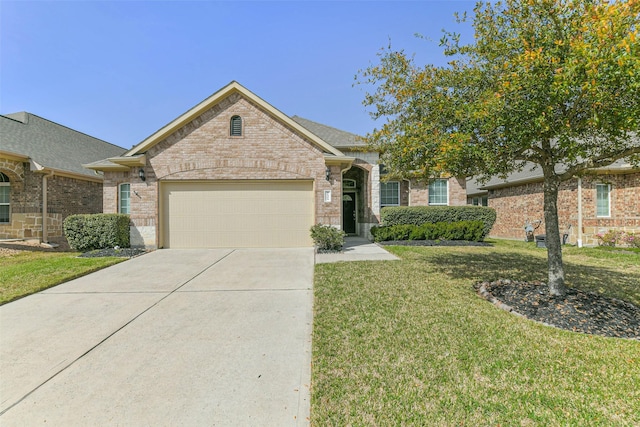 view of front of property featuring concrete driveway, an attached garage, brick siding, and a front yard