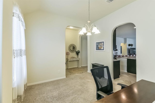 home office featuring baseboards, arched walkways, a notable chandelier, and light carpet