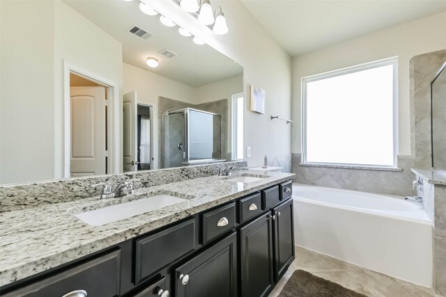 bathroom with a sink, visible vents, double vanity, and a shower stall