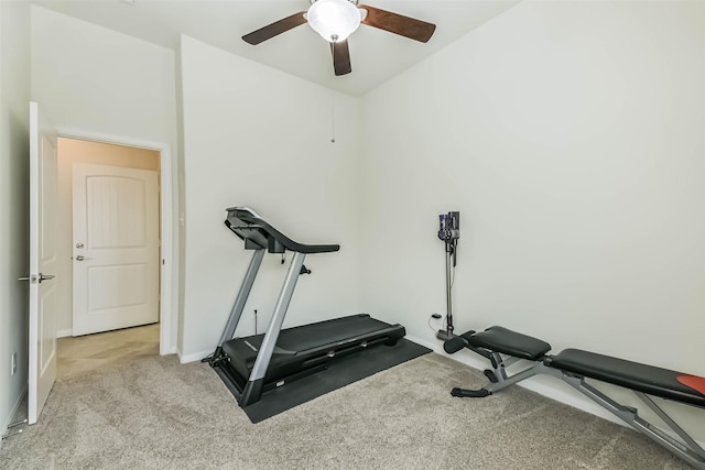 workout room featuring carpet flooring, a ceiling fan, and baseboards