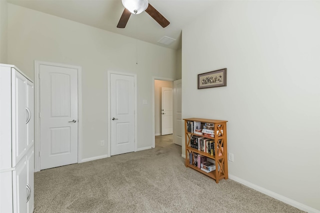 bedroom with baseboards, carpet, and a ceiling fan