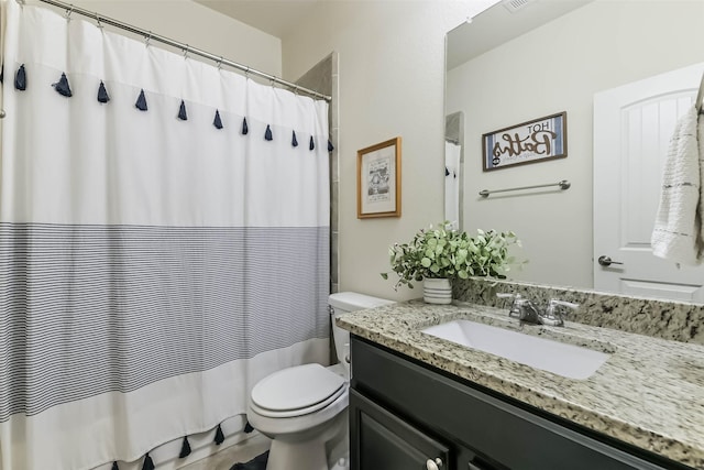 bathroom with a shower with shower curtain, toilet, vanity, and visible vents