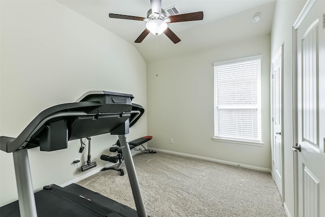 workout room featuring visible vents, baseboards, ceiling fan, vaulted ceiling, and carpet floors