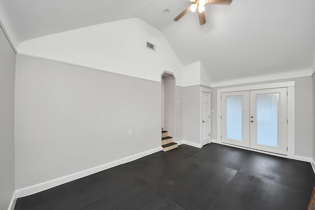 unfurnished living room featuring visible vents, baseboards, french doors, lofted ceiling, and ceiling fan