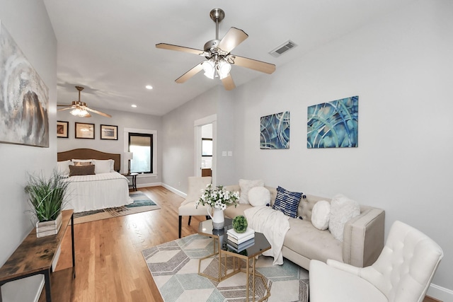 bedroom featuring visible vents, recessed lighting, baseboards, and wood finished floors