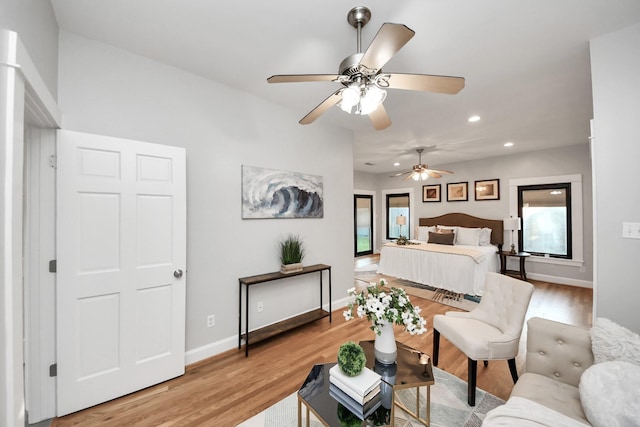 bedroom featuring recessed lighting, light wood-style flooring, and baseboards