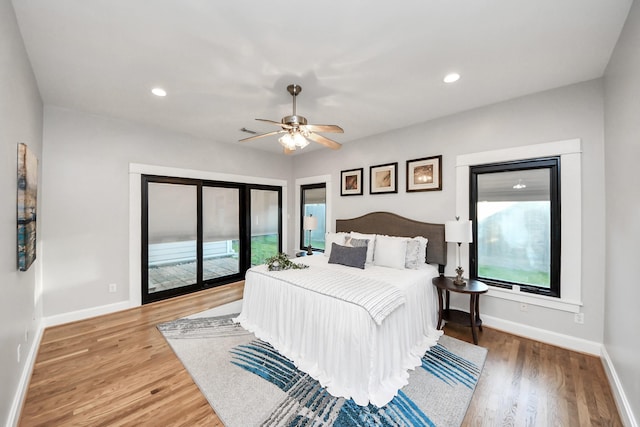 bedroom featuring light wood-type flooring, a ceiling fan, access to outside, recessed lighting, and baseboards