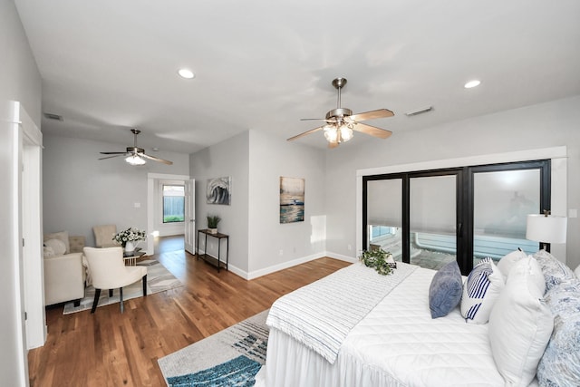 bedroom with wood finished floors, visible vents, baseboards, recessed lighting, and access to outside