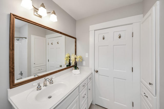 full bath featuring vanity and a shower